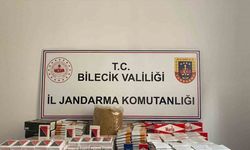 Jandarmanın baskın yaptığı evde kaçak tütün ve ruhsatsız silah ele geçirildi