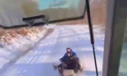 Bursa'da çocuklar traktöre bağlanan lastiklerle karın keyfini çıkardı