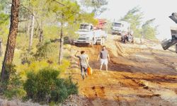 Fethiye Üzümlü'deki orman yangınında havadan ve karadan yoğun mücadele