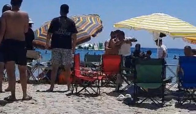 Çeşme'de plajda 'Şemsiyeni açamazsın' kavgası